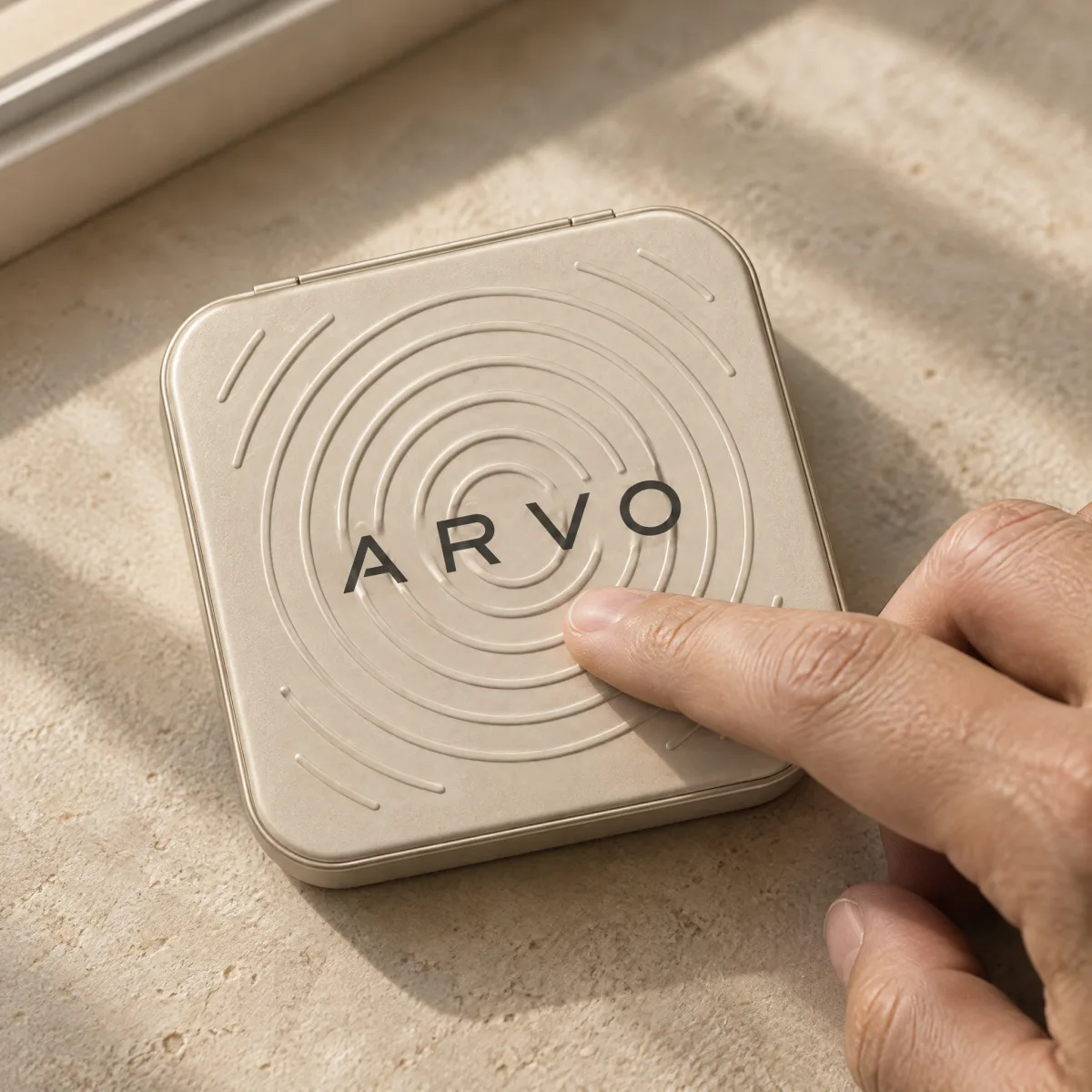 A finger tracing the rings of the ARVO ripple box